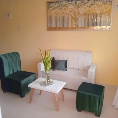 a living room with a couch and a table and chairs at comodo apartamento in Barranquilla