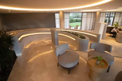 a lobby with two chairs and a table at Exclusive Apartment With Ocean View By Huespedia in Cartagena de Indias