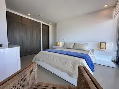 a large white bedroom with a large bed in it at MC 1303- beach front apt- Morros City top location in Cartagena de Indias