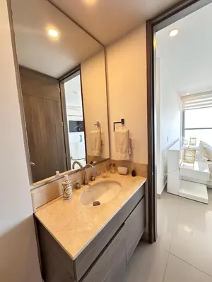 a bathroom with a sink and a large mirror at MC 1303- beach front apt- Morros City top location in Cartagena de Indias