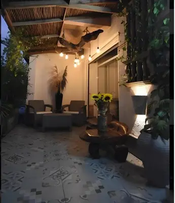 a living room with a couch and a table at Hotel Boutique Tierra Del Mar Cartagena in Cartagena de Indias
