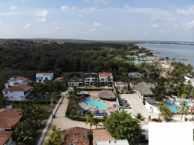 an aerial view of a resort and the water at Cabaña doña Santi in San Antero