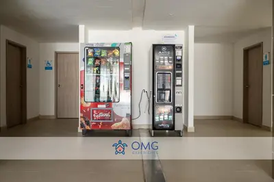 two vending machines are standing next to each other at CB1622 | Suite frente al mar con balcón y piscina in Cartagena de Indias
