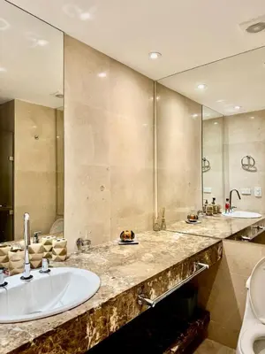 a bathroom with two sinks and a large mirror at Beautiful 2 BR Ocean View Condo in Cartagena in Cartagena de Indias