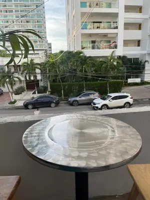 a table with cars parked on a city street at Habitación cerca de la playa 201 in Cartagena de Indias