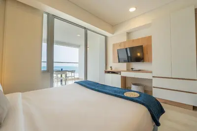 a bedroom with a bed with a view of the ocean at CB802 | Escapada frente al mar en Cartagena in Cartagena de Indias