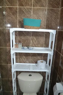 a bathroom with a toilet and a sink at Bocagrande cerca del mar in Cartagena de Indias