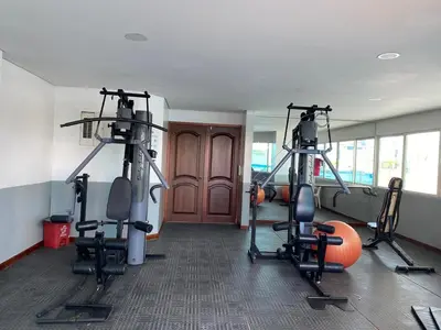 a gym with several tread machines in a room at Tropical Paradise - vista al mar, el Laguito Cartagena in Cartagena de Indias