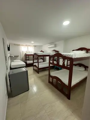 a group of bunk beds in a room at Hotel Restaurante Arrecife in Isla de Tierra Bomba