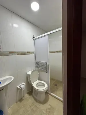 a bathroom with a toilet and a shower and a sink at Hotel Restaurante Arrecife in Isla de Tierra Bomba