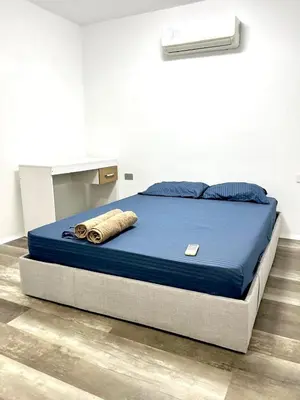 a bed in a room with a blue mattress at Habitación cerca de la playa 103 in Cartagena de Indias