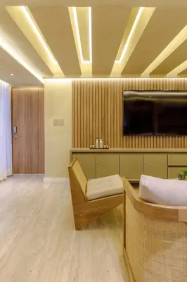 a room with a couch and a tv on a ceiling at Suites la iglesia in Cartagena de Indias