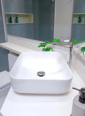 a white sink on a counter in a bathroom at Apartment Hilton Garden Inn Building in Barranquilla