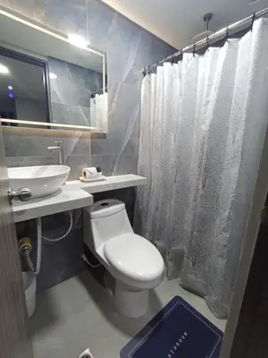 a bathroom with a white toilet and a sink at Amaneceres de ensueño en Cartagena in Cartagena de Indias
