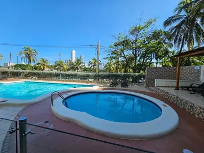 a large swimming pool with a large swimming pool at Vacation Home with water views in every room! in Cartagena de Indias