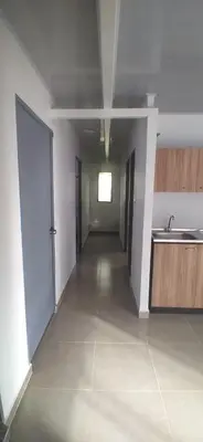 an empty room with a kitchen and a sink at Casa de playa moñitos in Moñitos