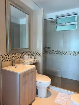 a bathroom with a toilet and a sink and a shower at Palmeto Beach 04 - 1 alcoba in Cartagena de Indias