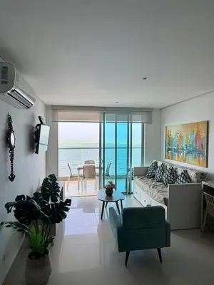 a living room with a couch and a table at Palmeto Beach 04 - 1 alcoba in Cartagena de Indias