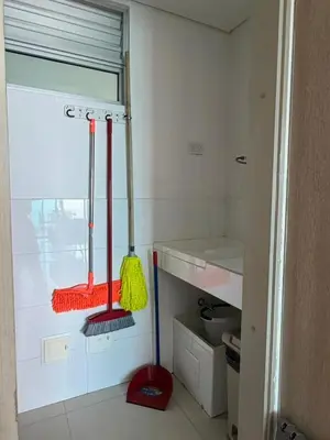 a kitchen with two mop and a broom on the wall at Palmeto Beach 04 - 1 alcoba in Cartagena de Indias
