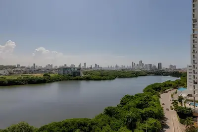 a river with a city in the background at Lujoso y Nuevo Cerca al Centro/ Piscina Panorámica in Cartagena de Indias