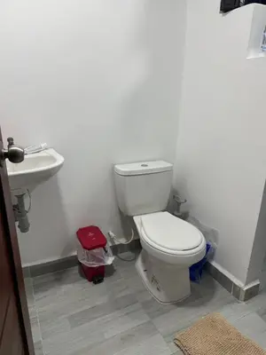 a bathroom with a toilet and a sink at Playa y selva in Puerto Viejo