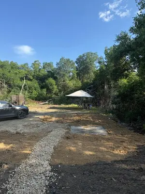 a car parked in a parking lot with a tent at Playa y selva in Puerto Viejo