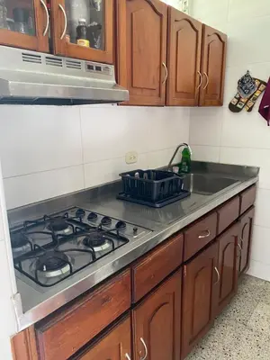a kitchen with a stove and a sink at Playa Los alcatraces in Santa Marta
