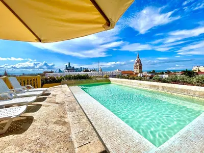 a swimming pool on the roof of a building at by Calamari Homes - El Porvenir 401 walled city in Cartagena de Indias