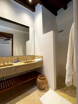 a bathroom with two sinks and a large mirror at Colonial House with Pool in Cartagena de Indias