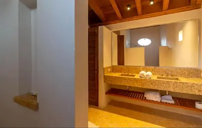 a bathroom with two sinks and a large mirror at Colonial House with Pool in Cartagena de Indias