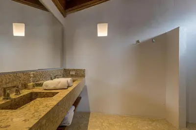 a bathroom with two sinks and a large mirror at Colonial House with Pool in Cartagena de Indias