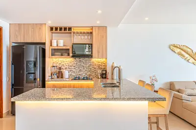 a kitchen with a counter top and a refrigerator at Cartagena Dreams in Cartagena de Indias