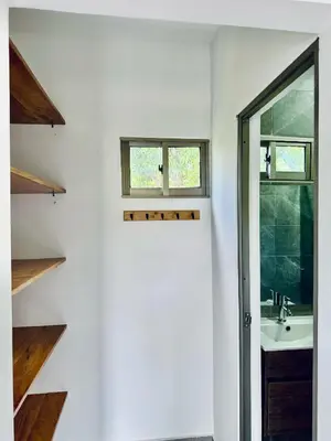 a bathroom with a sink and a window at Cabaña La Roca in San Antero