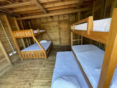 a room with two bunk beds in a cabin at Prueba1 in Tintipan Island