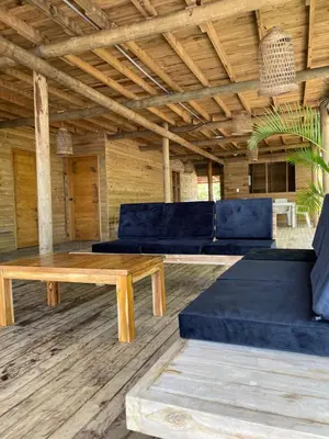 a living room with a couch and a table at Prueba1 in Tintipan Island