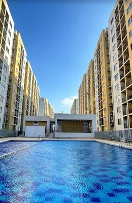 a swimming pool in front of some tall buildings at Apartamento norte de Barranquilla in Barranquilla