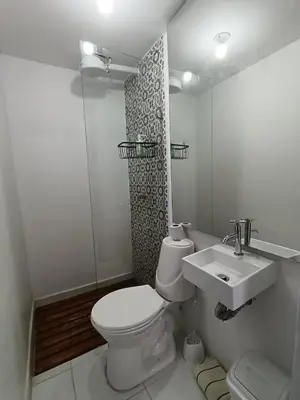 a bathroom with a toilet and a sink at Comfy apartment in historic center in Cartagena de Indias