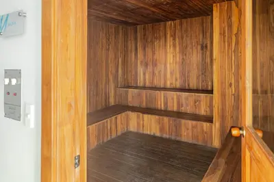 a sauna with wooden walls and a wooden floor at Paraíso Costero Apartamento de Lujo con Vista Directa al Mar in Cartagena de Indias