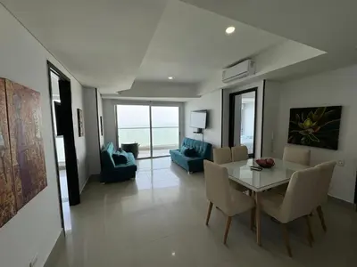 a living room with a dining room table and chairs at Apartamento Palmetto Eliptic ICDI in Cartagena de Indias
