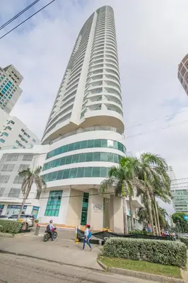 a tall building with people walking in front of it at Apartamento Palmetto Eliptic ICDI in Cartagena de Indias