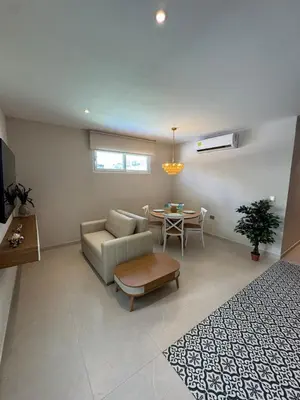 a living room with a couch and a table at Comfort Retreat in Bocagrande in Cartagena de Indias