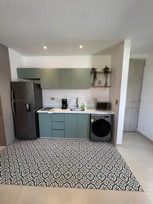 a kitchen with a sink and a refrigerator at Comfort Retreat in Bocagrande in Cartagena de Indias