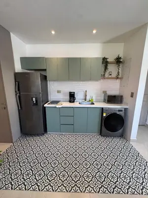 a kitchen with a sink and a refrigerator at Comfort Retreat in Bocagrande in Cartagena de Indias