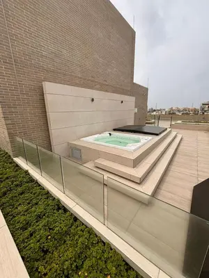 a building with a swimming pool on the side of it at District Aptosuite 404 in Barranquilla
