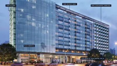 a large glass building with street names on it at District Aptosuite 404 in Barranquilla