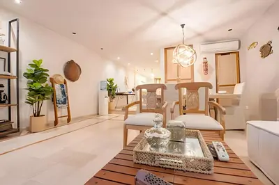 a living room with chairs and a table at Modern and cozy Beachfront house Santa Marta 7pax in Simón Bolívar International Airport
