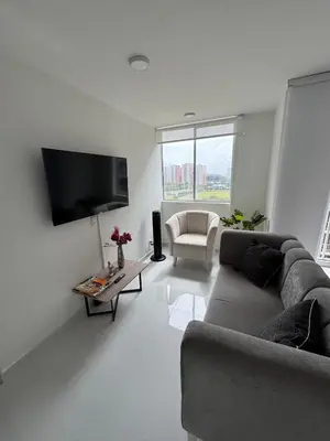 a living room with a couch and a tv at Apartmento en Ciudad Mallorquín in Puerto Colombia