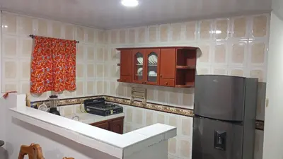 a kitchen with a refrigerator and a stove at Apartamento #6 in Puerto Colombia
