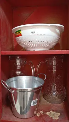 a shelf with a bowl and a bowl and glass jars at Apartamento #7 in Puerto Colombia