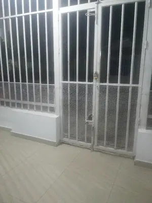 a room with white barred gates in a building at Rey Salomón in Barranquilla